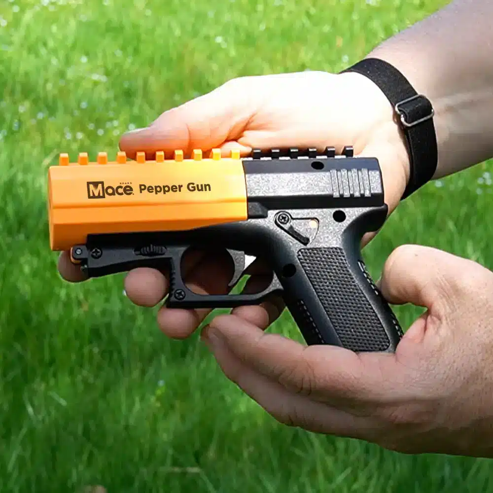 Mace Pepper Gun Holding gun showing size