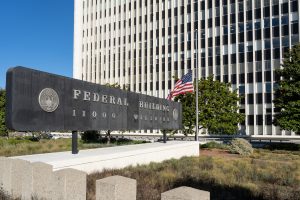 Federal Building with Prohibited Weapons Sign – Overview of restrictions on carrying weapons like pepper spray in federal facilities